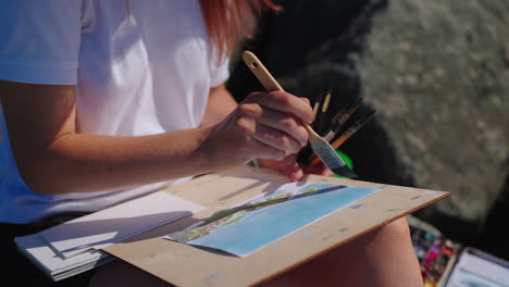 woman painting outdoors