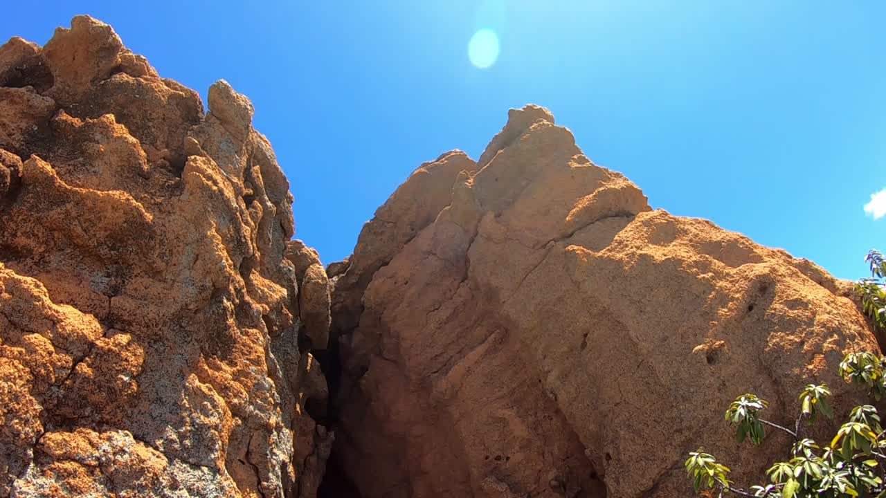 Looking up at Large Sandstone boulders and rock formations