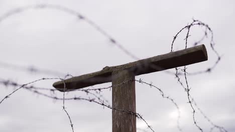 barbed wire on the pole against the sky - slow motion