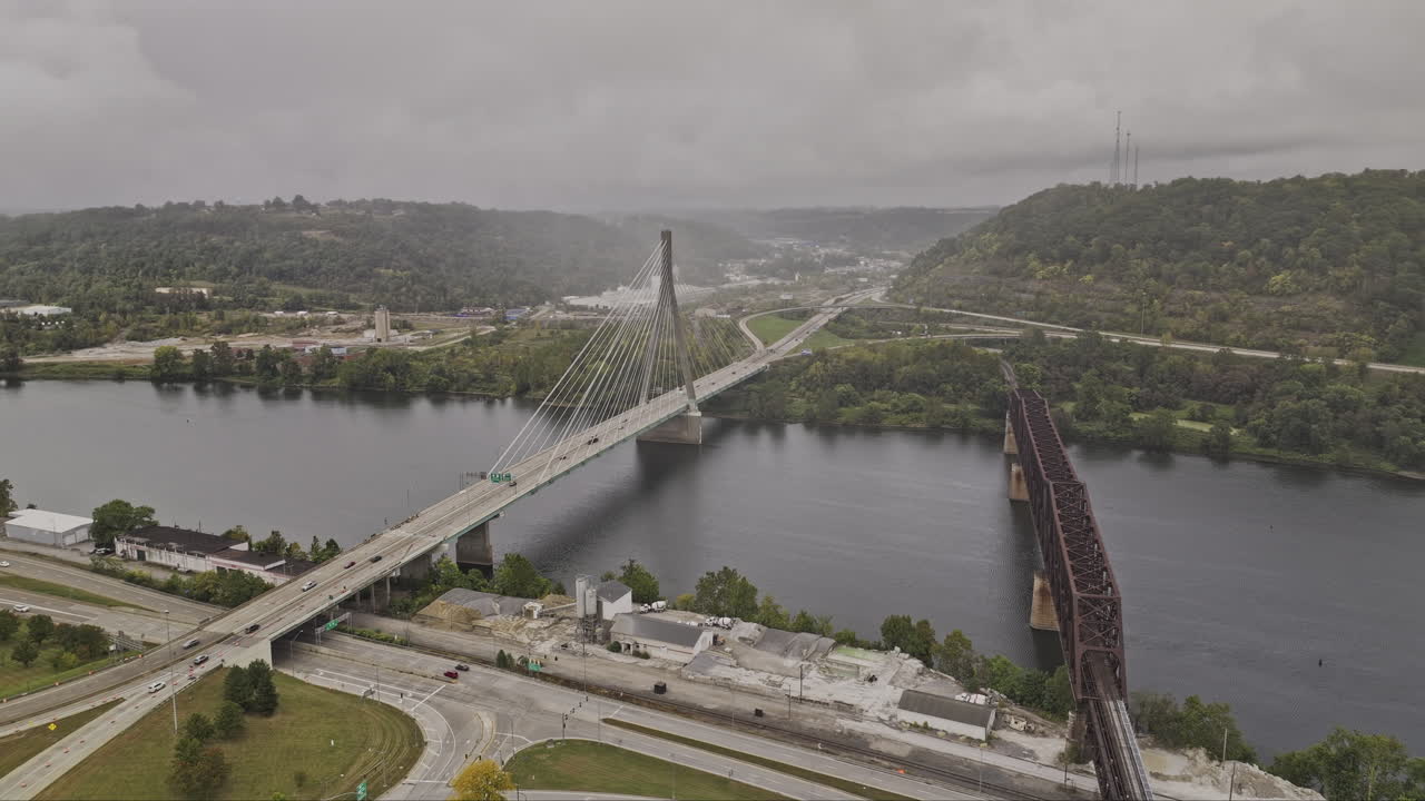 Steubenville Ohio Aerial v4 flyover Jacksonville capturing a modern cable-stayed bridge, crossing the Ohio River alongside an older truss railroad bridge - Shot with Mavic 3 Pro Cine - Sept 22nd 2023