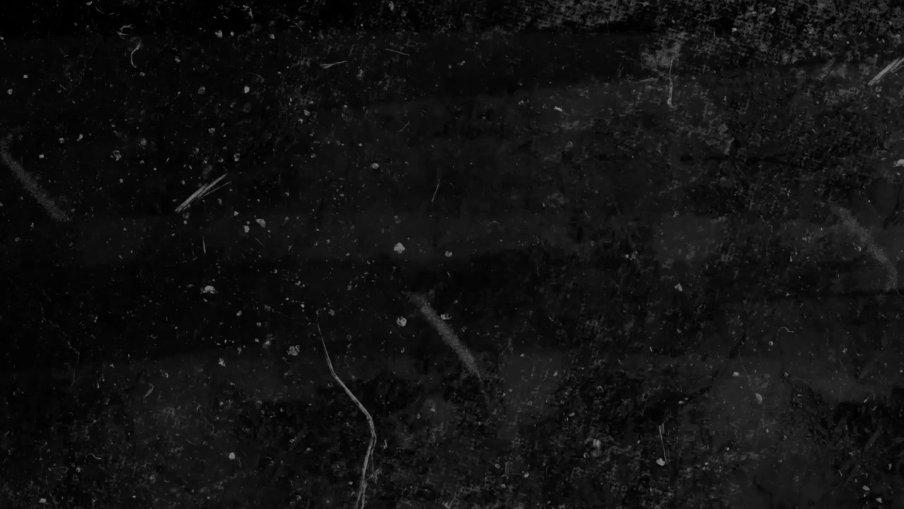 Mørk grunge teksturbakgrunn med bevegelig støv og riper