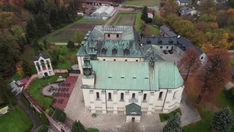 Aerial-view-of-church-of-Visitation-of-the-Blessed-Virgin-Mary-in-Żarki,-Poland