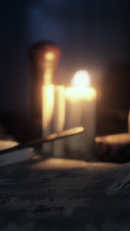 mysterious still life with candles and newspaper