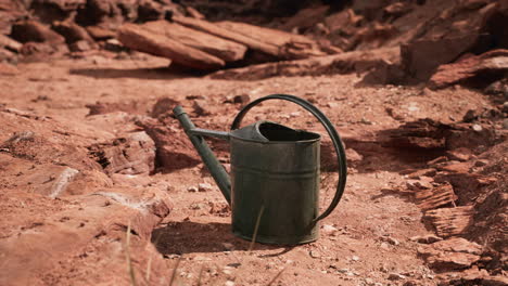 beverage can in sand and rocks desert