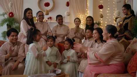 a joyful family gathering with women and children in traditional clothing