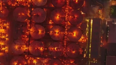 Drone-top-down-rotational-shot-of-metal-factory-at-night