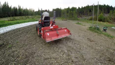 man suing tractor in the farm 4k