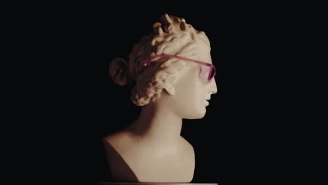 ancient bust with pink sunglasses