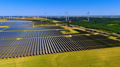 solar and wind energy grid. solar panels and wind turbines spread across the countryside, showcasing renewable energy on a sunny day