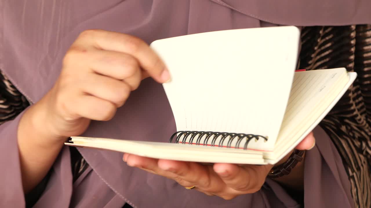 Woman Reading Notebook