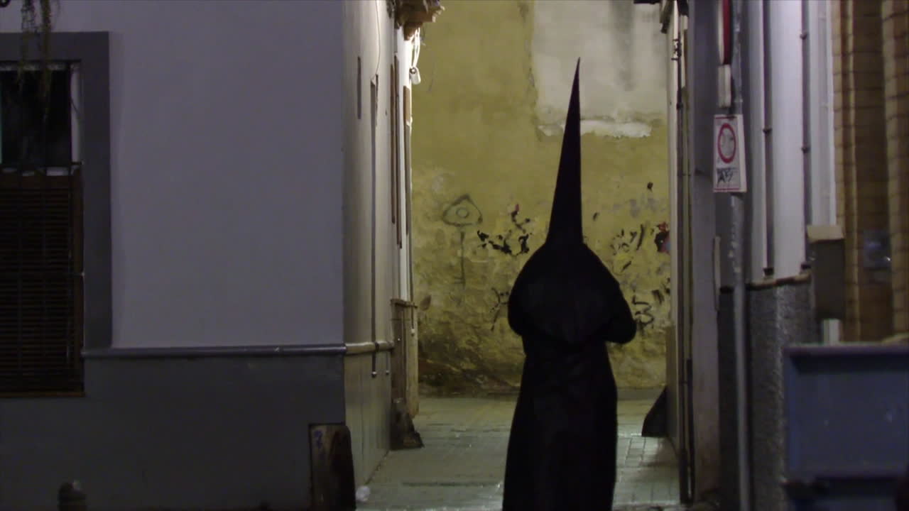 Religious Procession in a Narrow Alley at Night