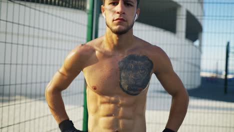 Sweat-athlete-man-with-lion-tattoo,-boxing-concept