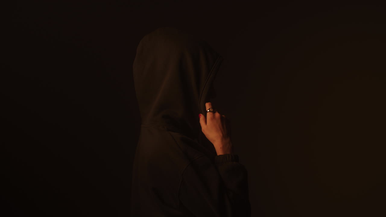 Person Wearing a Hoodie in Profile View