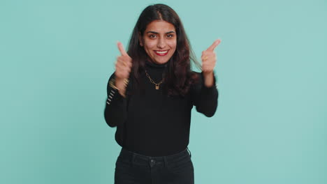 indian woman raises thumbs up agrees or gives positive reply recommends advertisement likes good