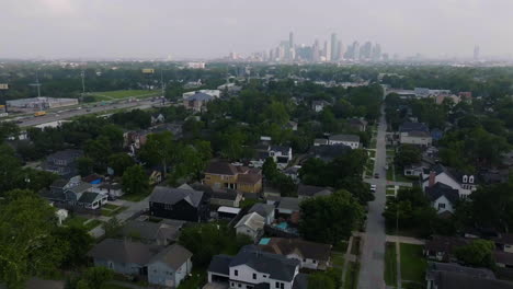 aerial view over neighborhoods with houston city downtown backdrop in texas, usa