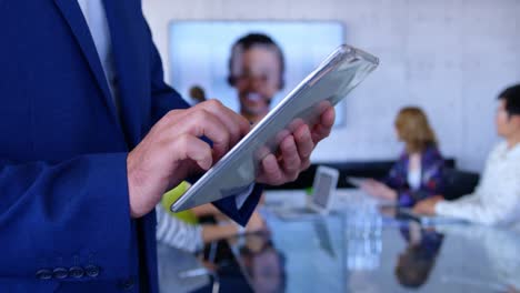 Caucasian-businesswoman-using-digital-tablet-in-the-conference-room-at-modern-office-4k