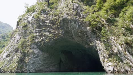 albania, lake koman, view of a cave inside the mountain