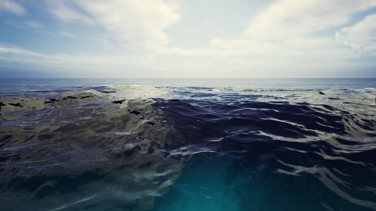 Vaste acque oceaniche che riflettono le nuvole sotto un cielo luminoso a mezzogiorno
