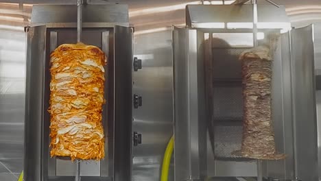 4k loop4-4 chicken breasts marinated vertical bbq rotisserie next to thinly sliced steaks stacks of sirloin triple 'a' beef shawarma rotating on a 360 degree upright spit in a stainless steel grill