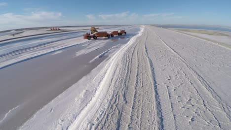 Aerial-shot-of-a-large-truck-before-being-filled-with-salt-in-the-salt-flats-by-solar-evaporation-in-Guerrero-Negro,-Ojo-de-Liebre-lagoon,-Biosphere-Reserve-of-El-Vizcaino,-Baja-California