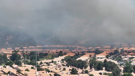 large-san-jancinto-wildlife-area-wildfire-over-sun-lakes-community-in-banning-california-fire-near-homes-AERIAL-TELEPHOTO-STATIC