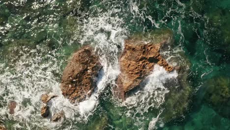 Aerial-high-angle-static-view-of-beautiful-turquoise-water-near-Rampla-Beach-on-the-Island-Gozo,-Malta