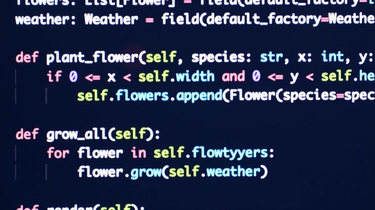 Código fuente de Python desplazándose en la pantalla de una computadora