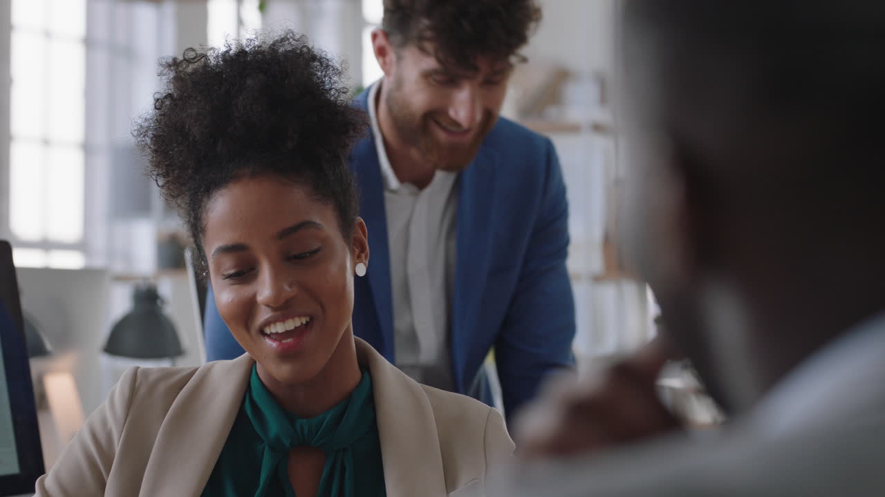 mixed race business woman chatting with colleagues in office meeting having conversation sharing ideas in corporate workplace