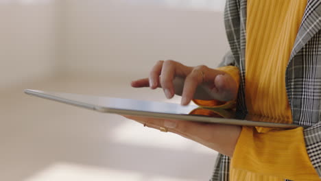 close-up-hands-using-digital-tablet-computer-browsing-online-social-media-on-mobile-touchscreen-device