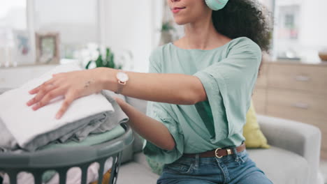 laundry, music and woman packing clothes