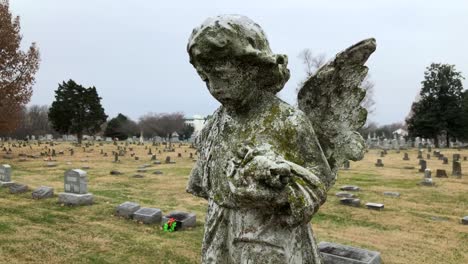 angel on top of gravestone