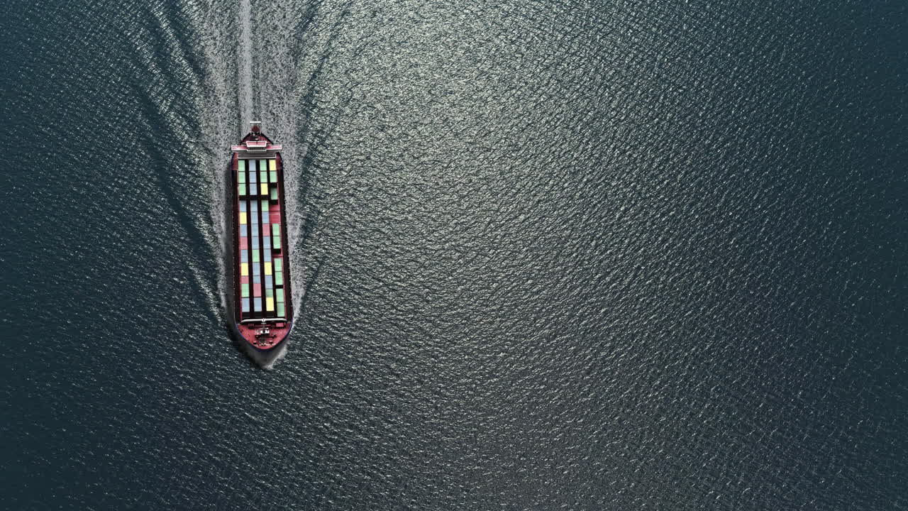 Aerial view of a container ship sailing on the sea