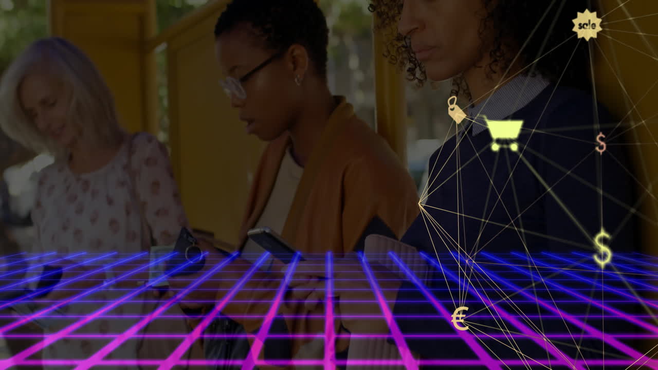 Three women standing at bus stop, using smartphones over neon grid showing ecommerce icons