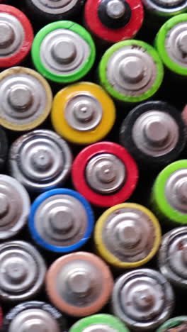 closeup of used aa finger batteries closeup of used aa finger batteries background of rotating batteries harmful effects of batteries