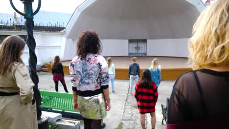 group of dancers on an outdoor stage