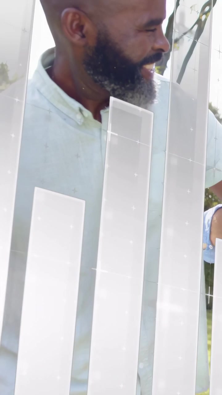 Vertical video: Mature man turning head and reacting in yard to floating finance graphs passing by