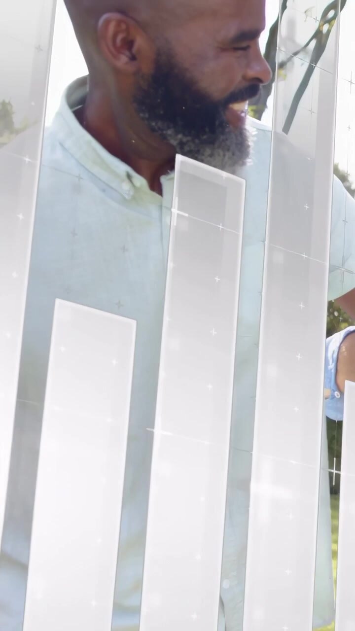 Vertical video: Mature man turning head and reacting in yard to floating finance graphs passing by