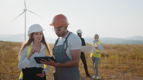 wind farm engineers inspecting and planning