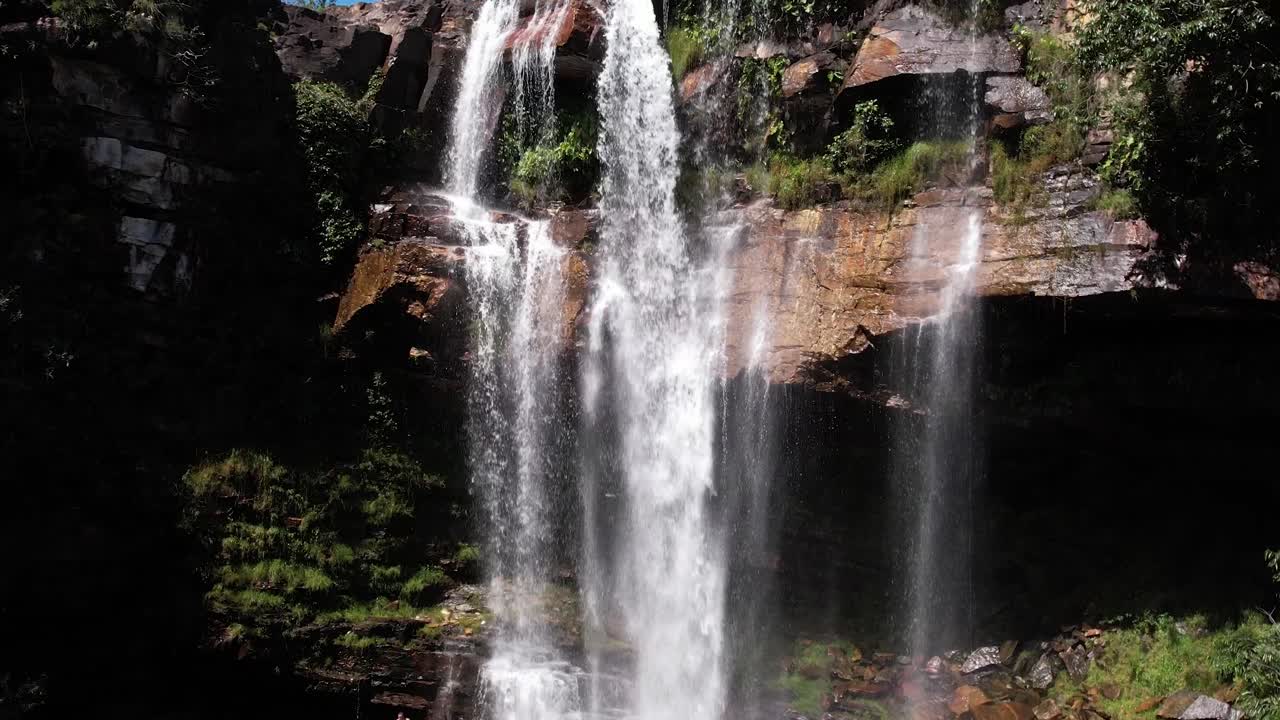 aerial view of the Cordovil waterfall, with rainbows, Chapada dos Veadeiros National Park, Goi&aacute;s, Brazil