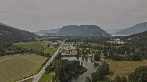 Sicamous-BC-Canada-Aerial-v1-flyover-Eagle-River-capturing-picturesque-landscape-featuring-agricultural-farmlands,-townscape-and-Shuswap-and-Mara-Lakes-views---Shot-with-Mavic-3-Pro-Cine---July-2023