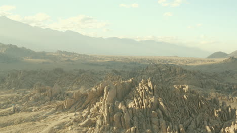 flight over smokey camp sites and rock formations of the alabama hills in california