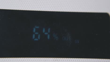 power bank screen with battery charge extreme closeup