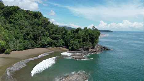 flying a drone through vegetation next to the beach of costa rica