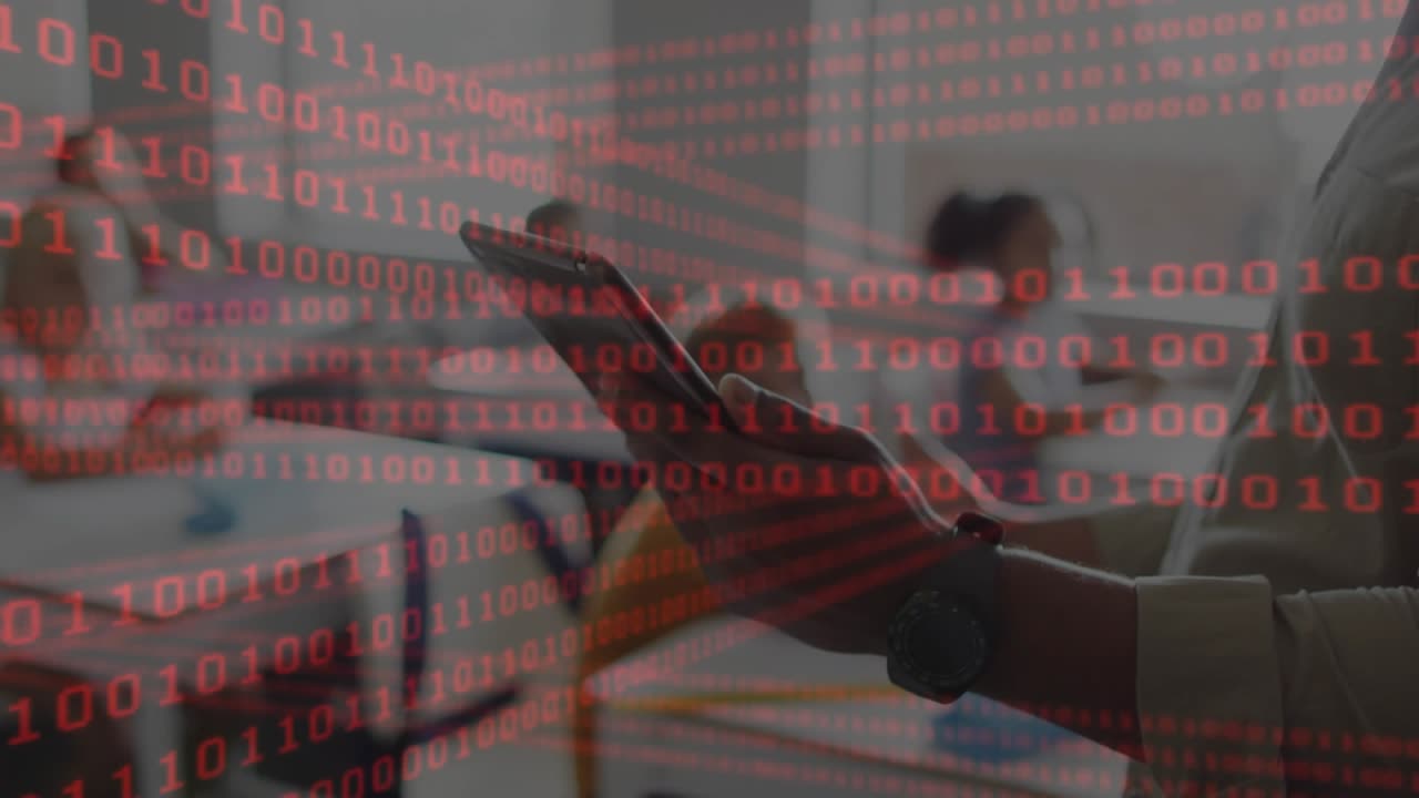 Hands swiping tablet screen, activating pulsing red binary overlay for business analytics in office