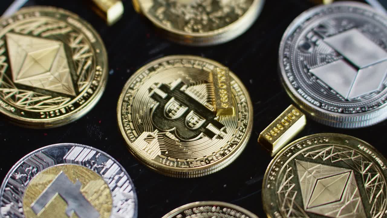 Bitcoin token surrounded by other cryptocurrency coins, small gold bars, bullion, symbolizing value, hedge against inflation