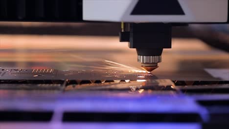 CNC-Laser-cutting-of-metal-in-slow-motion,-modern-industrial-technology.