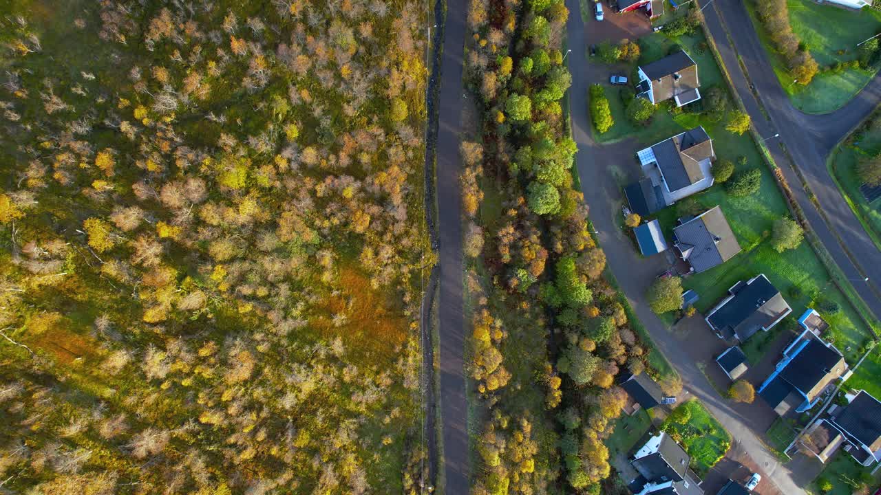 Aerial drone shot from the town called Sortland in Northern Norway during fall on a partly sunny day