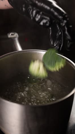 chef cooking broccoli