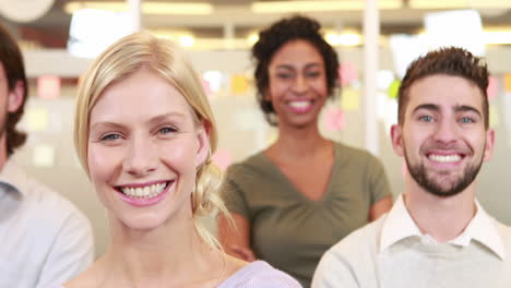 smiling casual business team posing
