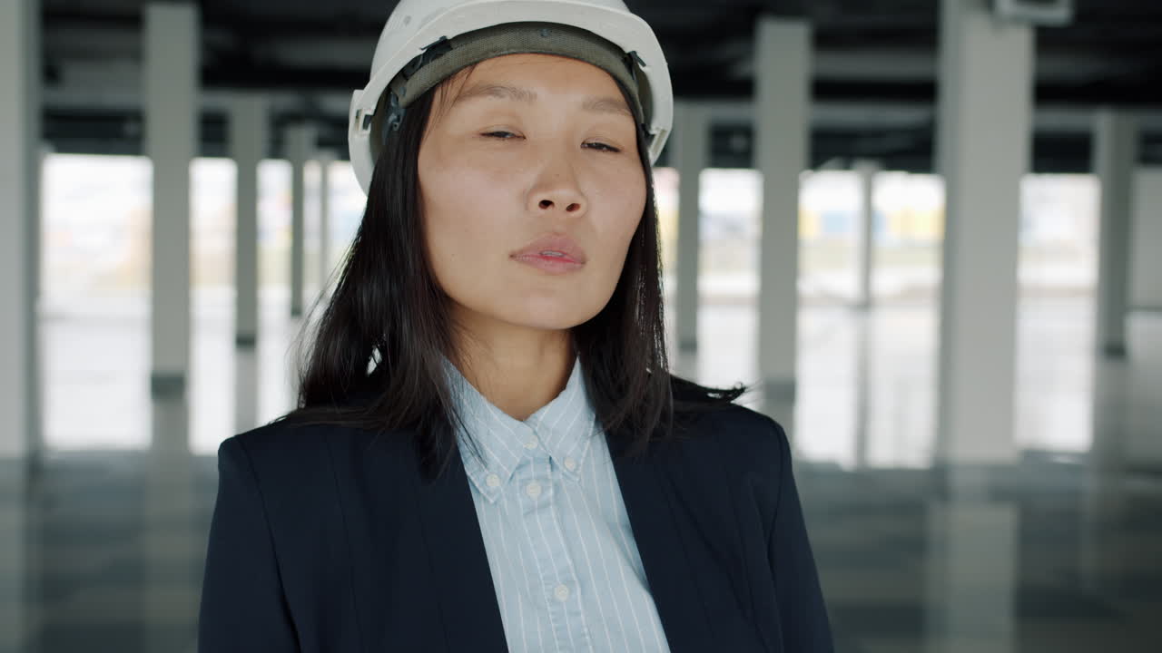 Asian female engineer in a construction site